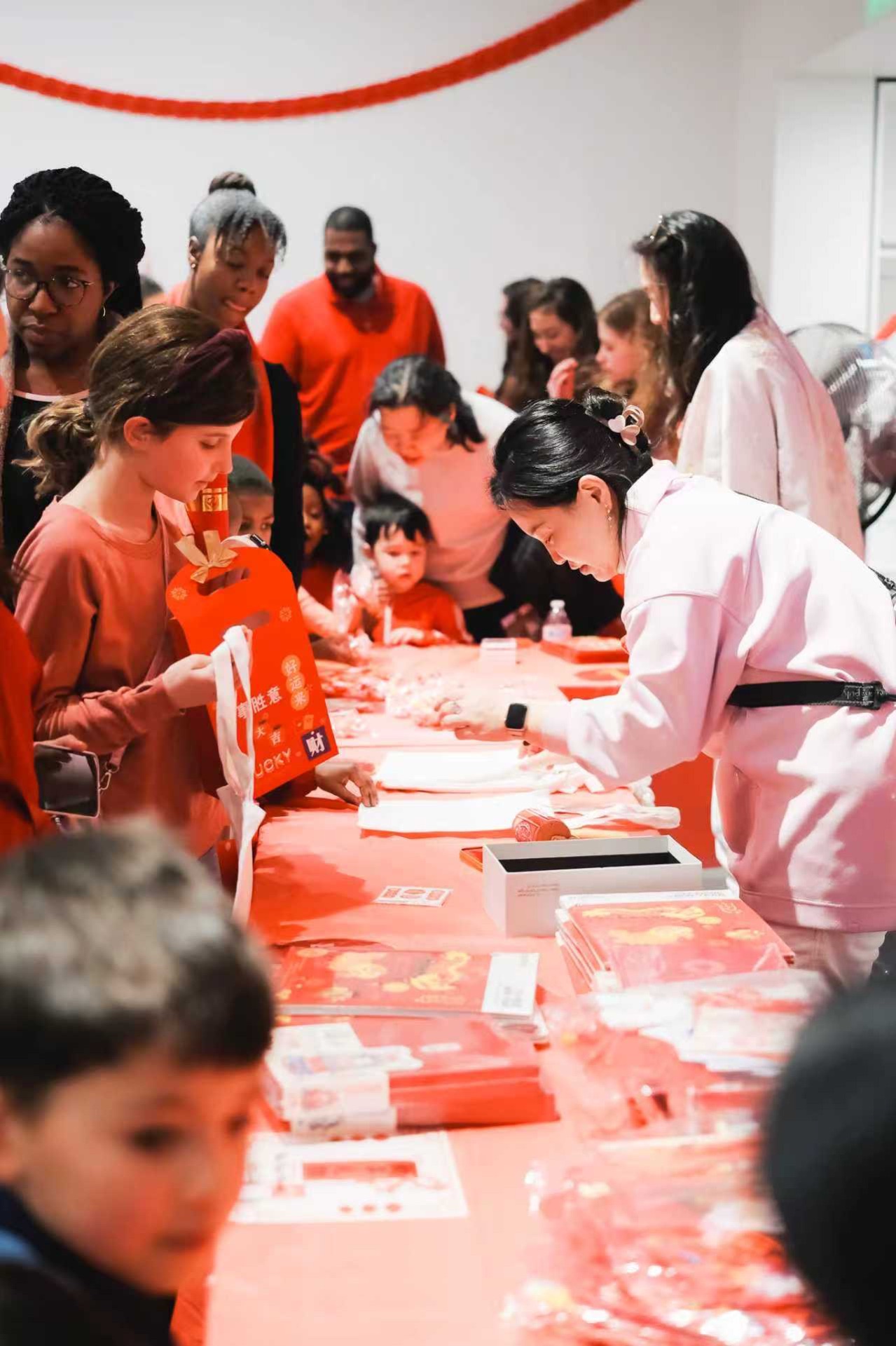 Multi-ethnic participants experiencing Chinese calligraphy and intangible heritage arts together 2
